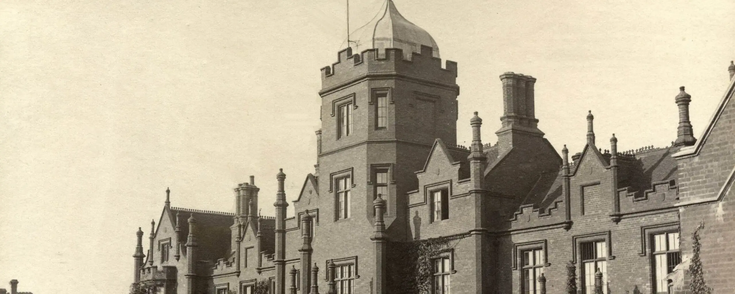 A vintage-style image of the Ipswich School building façade.