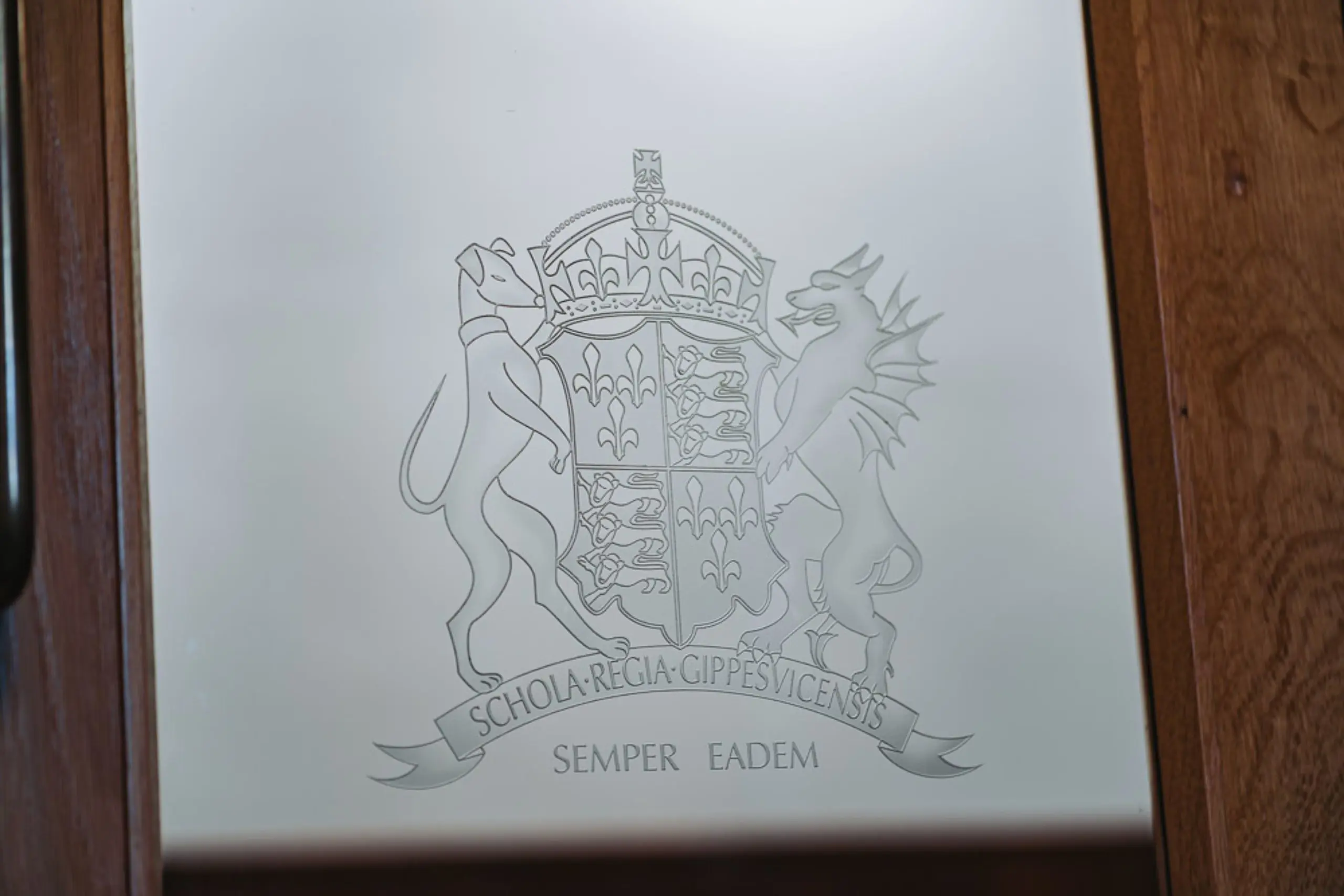 Ipswich School Crest and Motto decorating a door.
