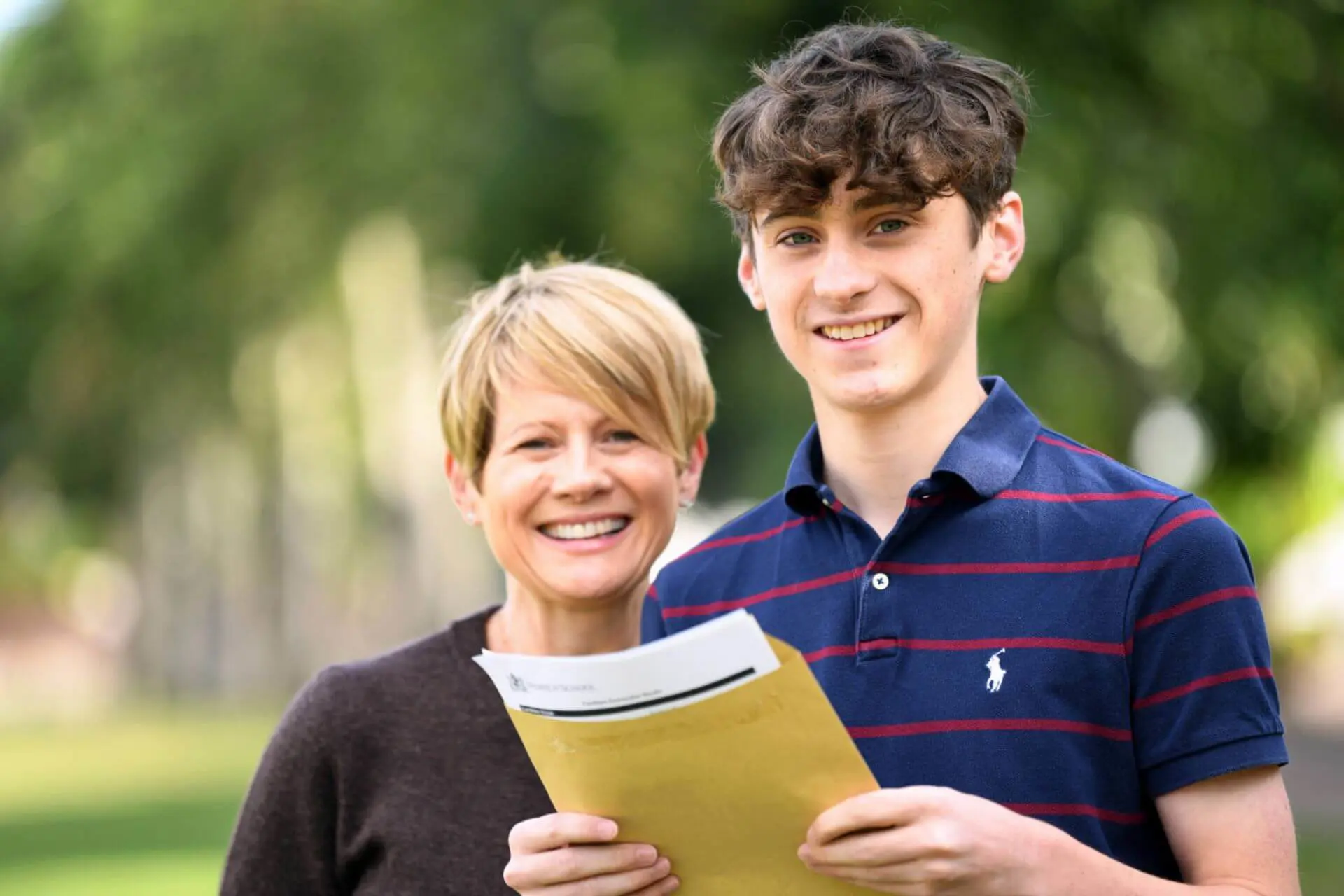Albert (pictured with his mother) achieved 10 grade 9s (A*).