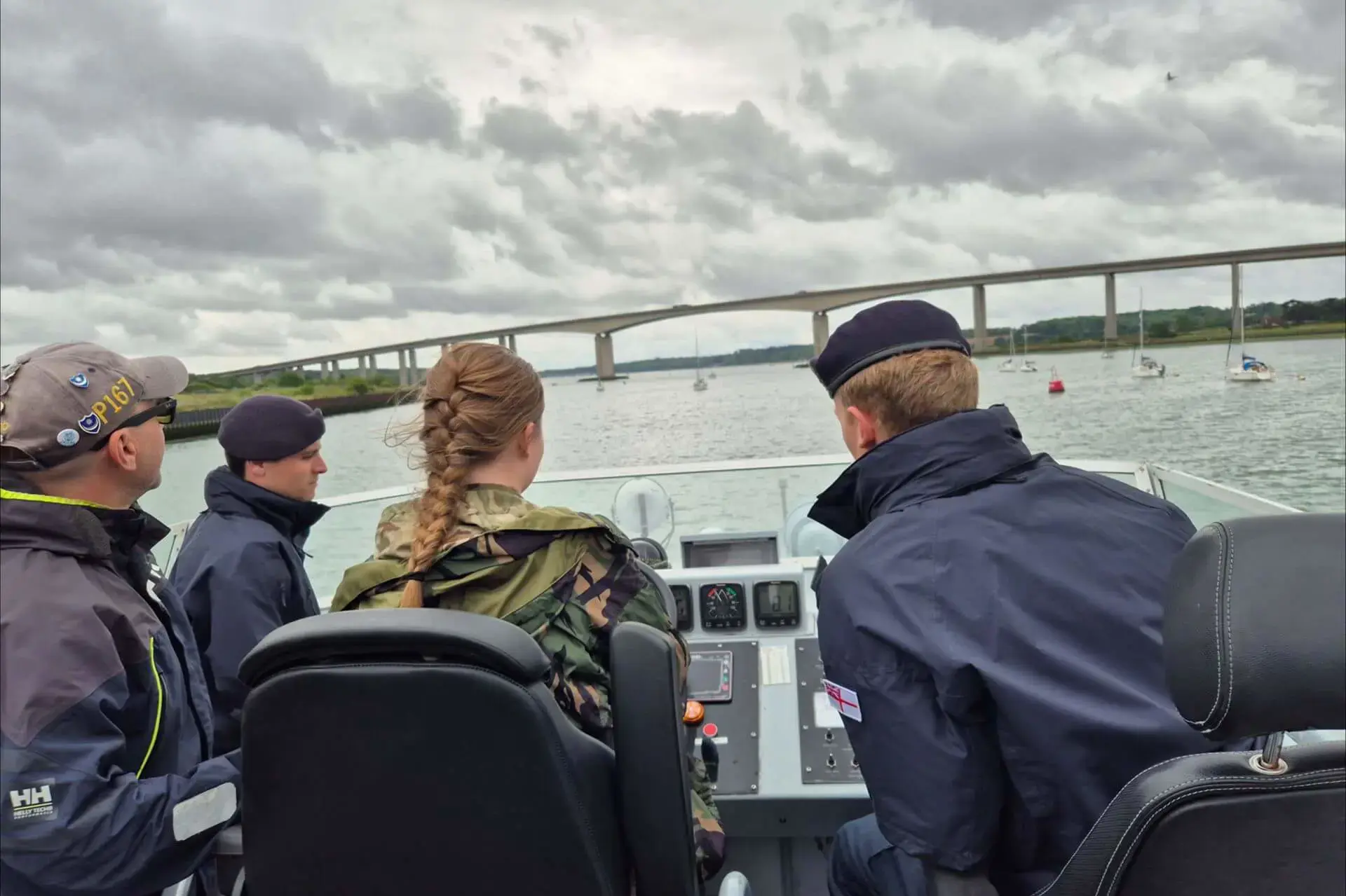 Ipswich School CCF student steering HMS Exploit.