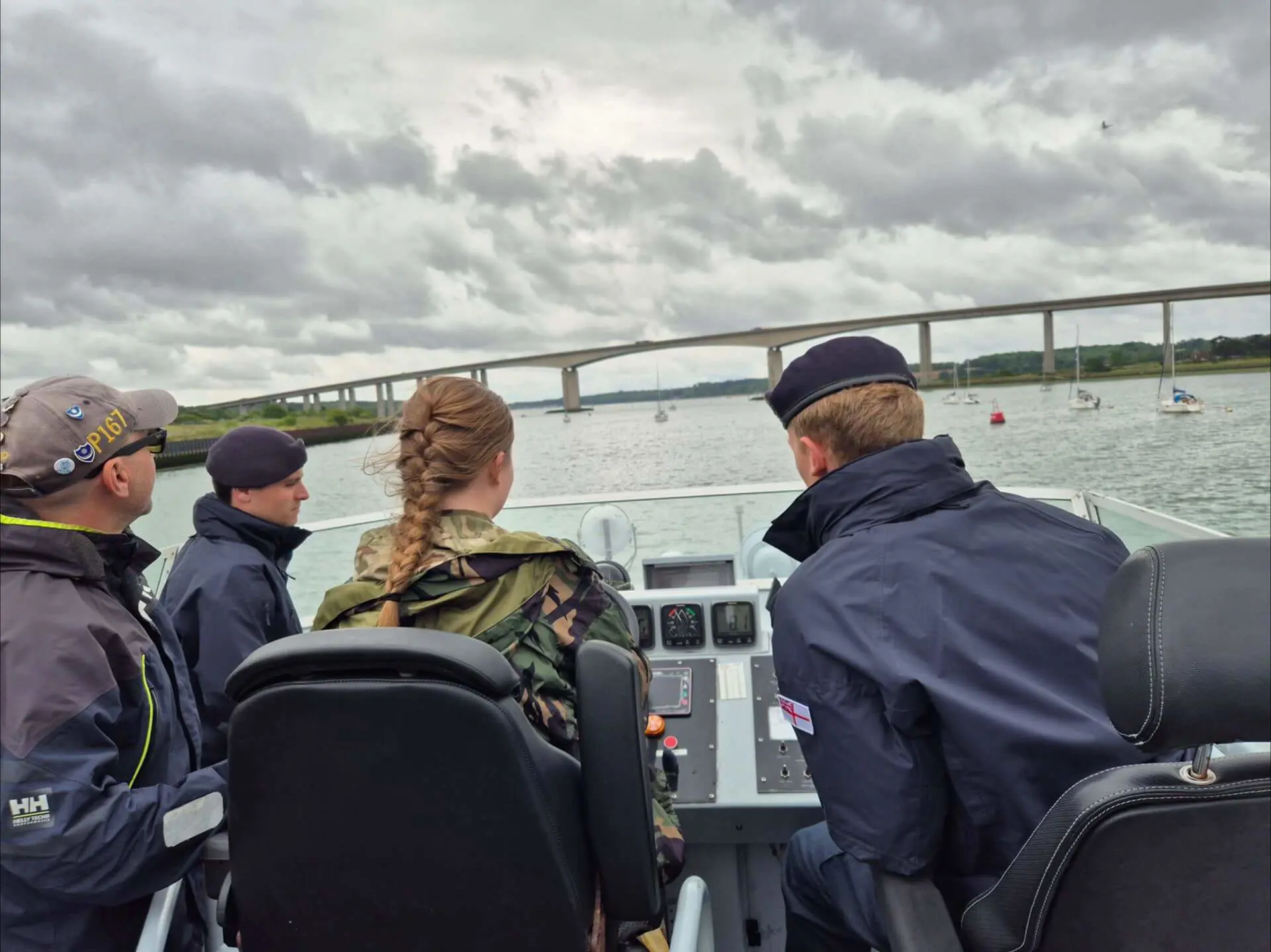 Ipswich School CCF student steering HMS Exploit.