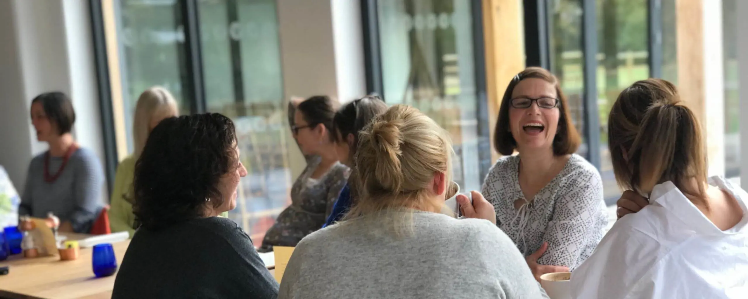 FOIS members chatting while having coffee together.