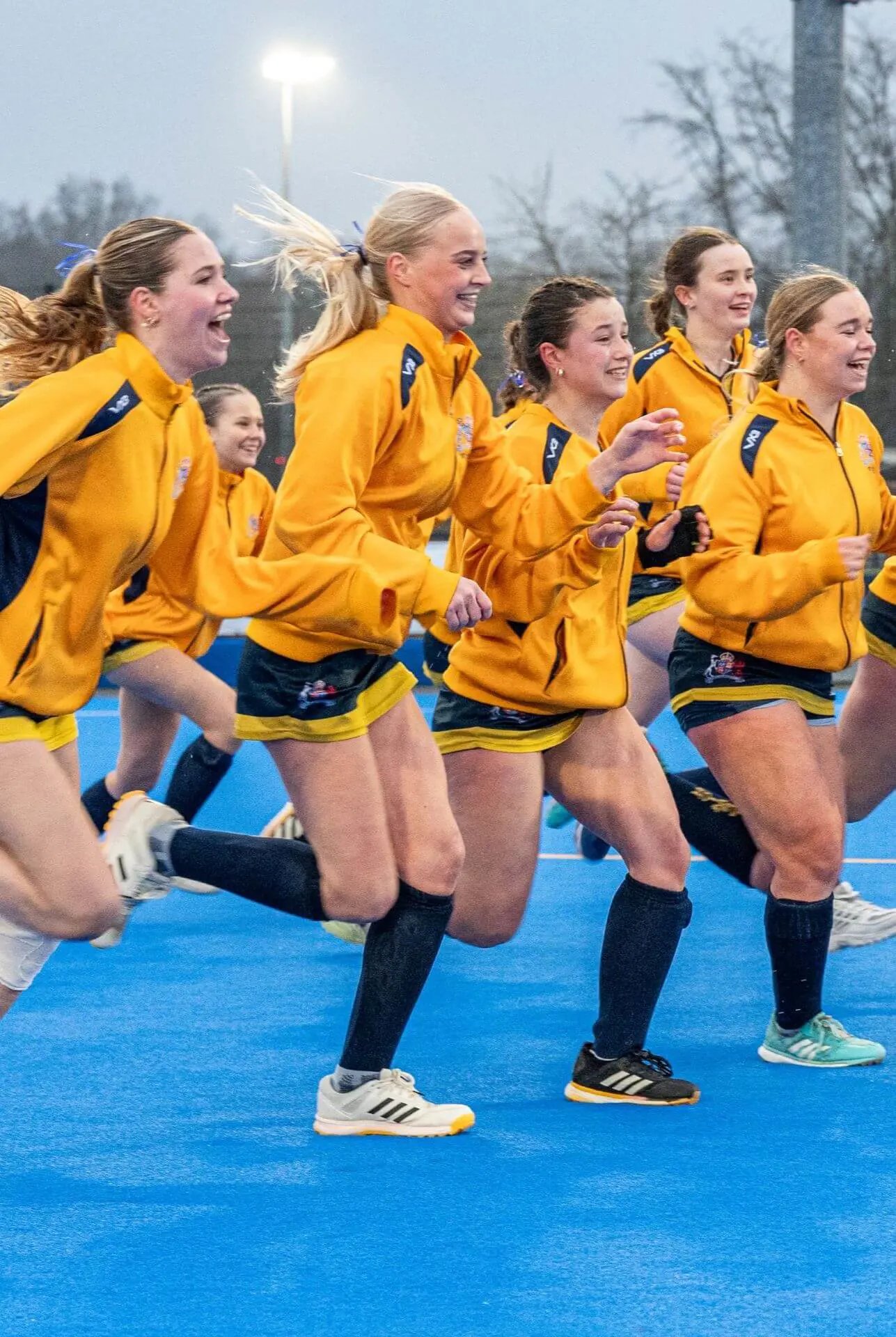 Ipswich School Girl's Hockey Team running