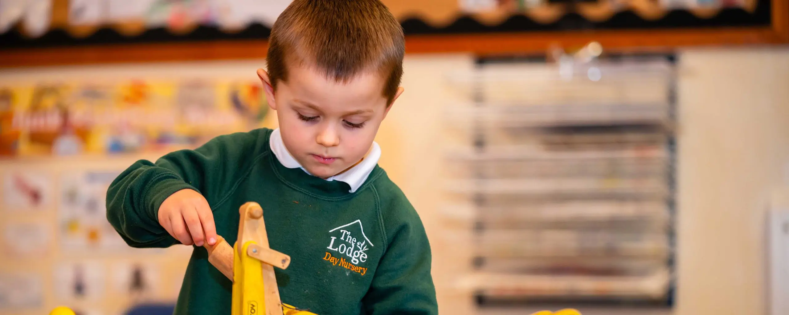 Ipswich School The Lodge Nursery pupil playing with a toy