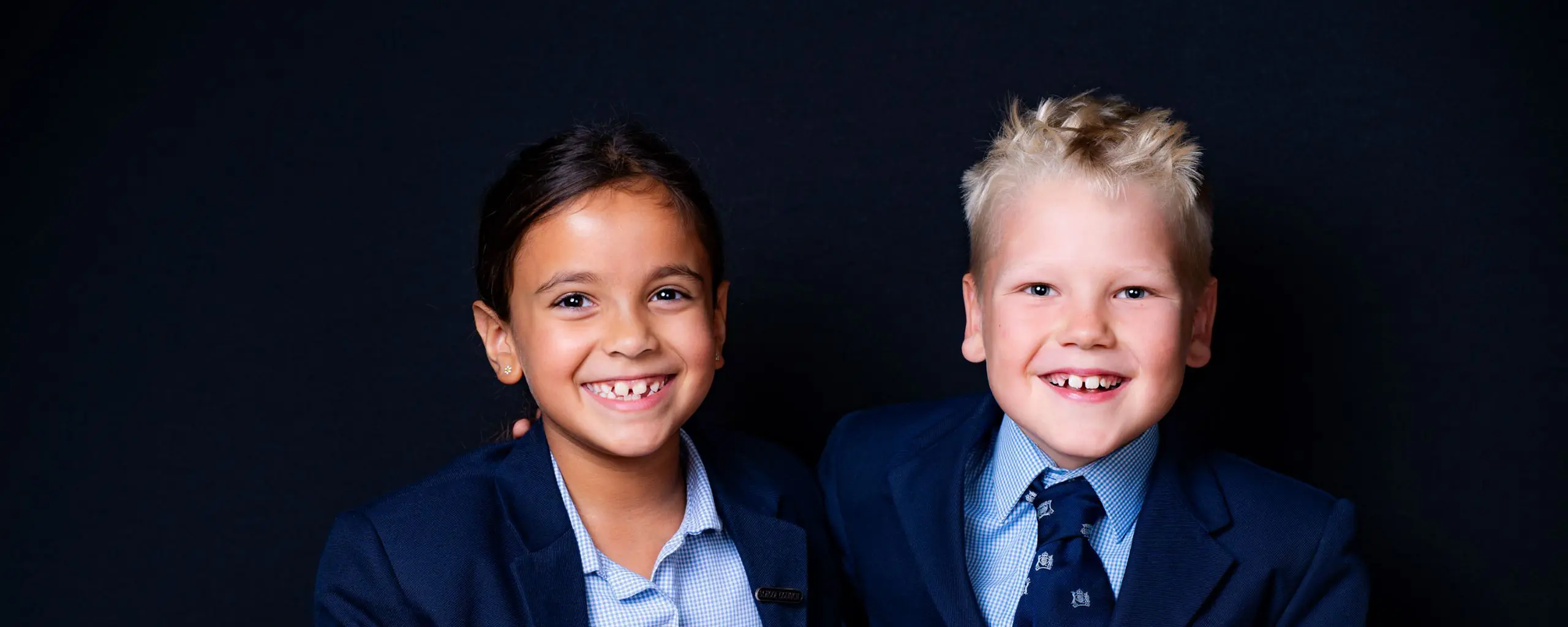 Ipswich School prep pupils smile for a photograph together.