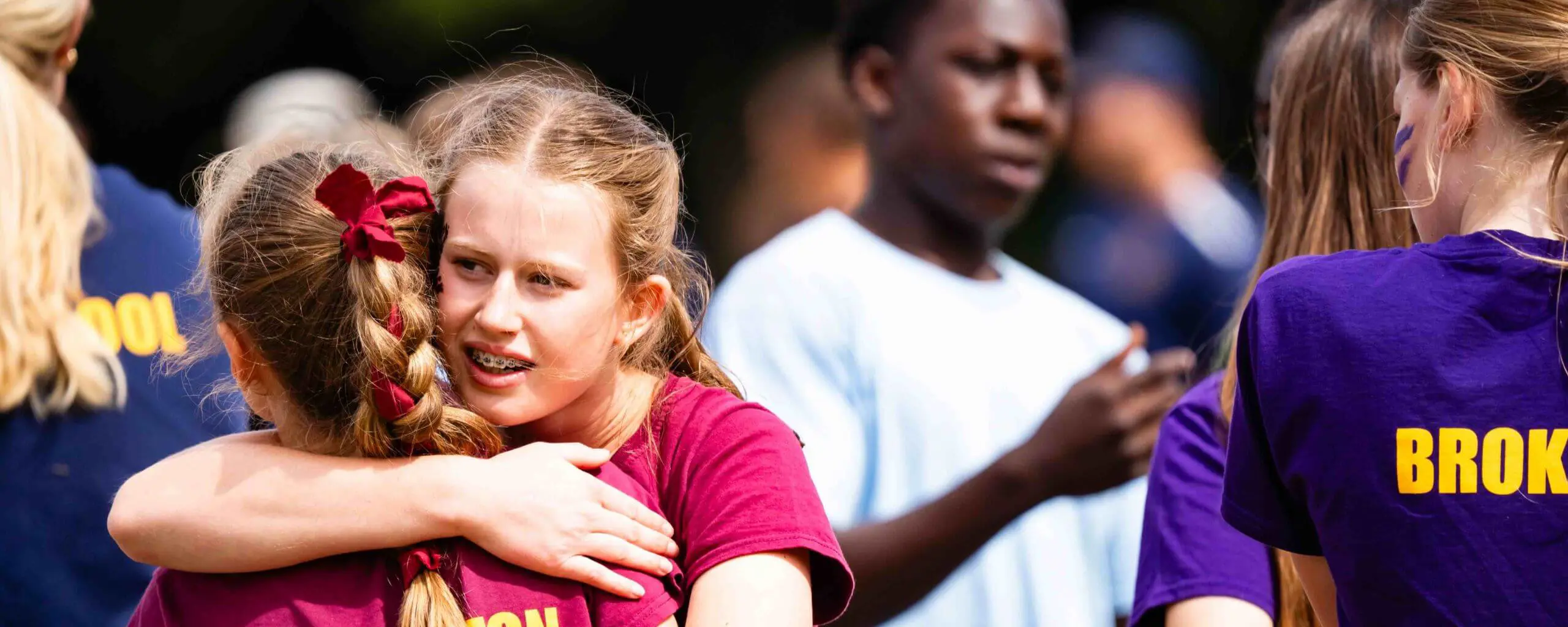 Ipswich School pupils hug at sports day