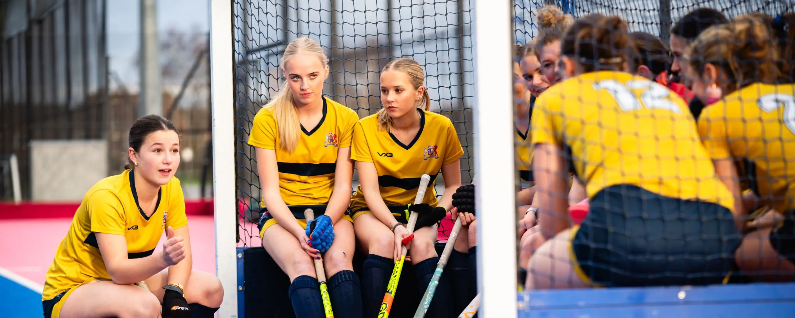 Ipswich School senior students at a hockey match.