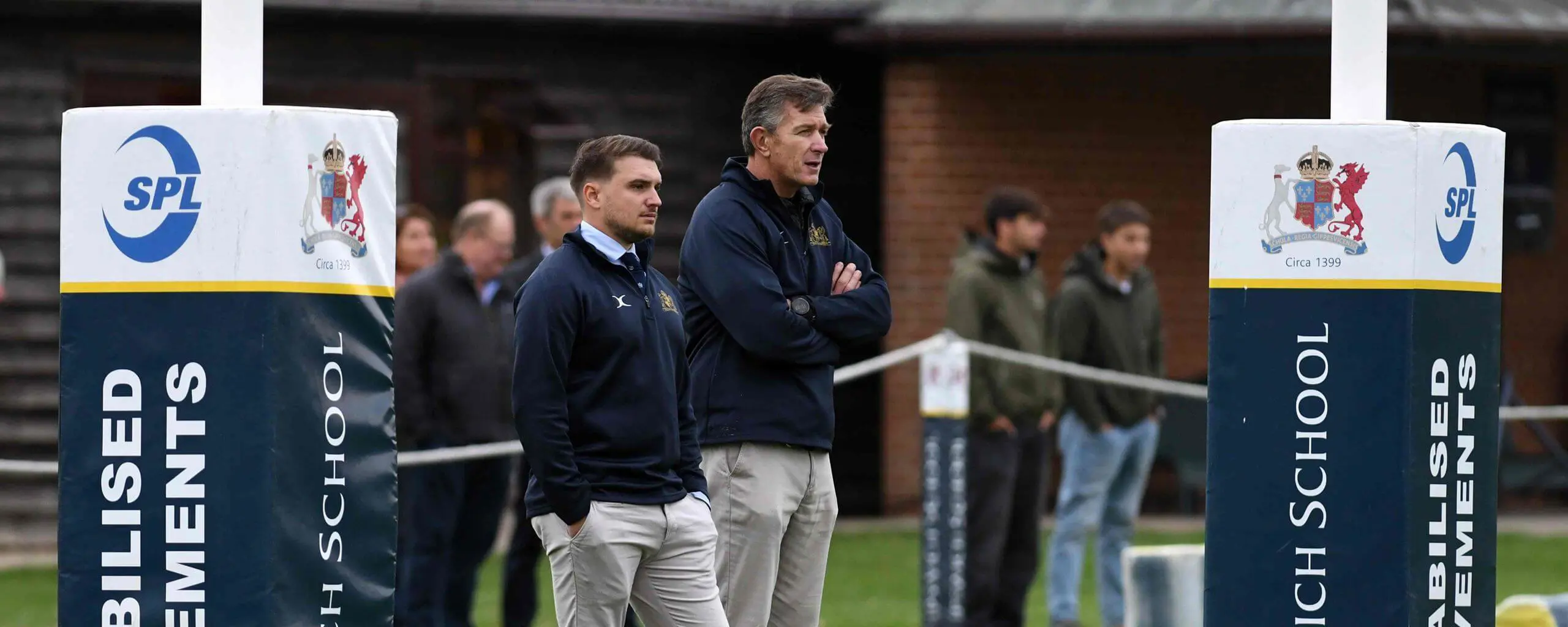 Ipswich School sports teachers on a rugby pitch.
