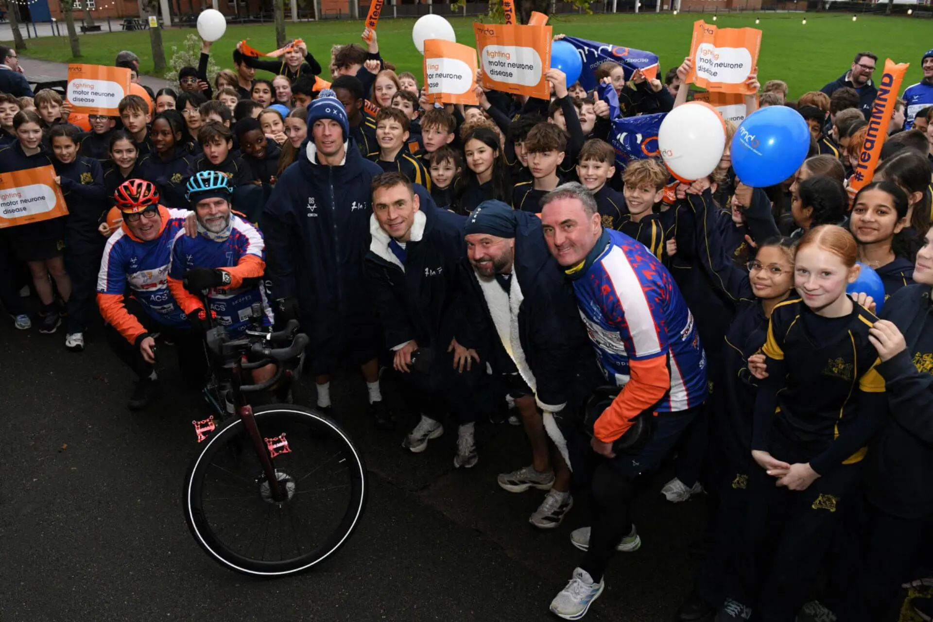 Kevin Sinfield posing for a photograph with pupils and staff at Ipswich School